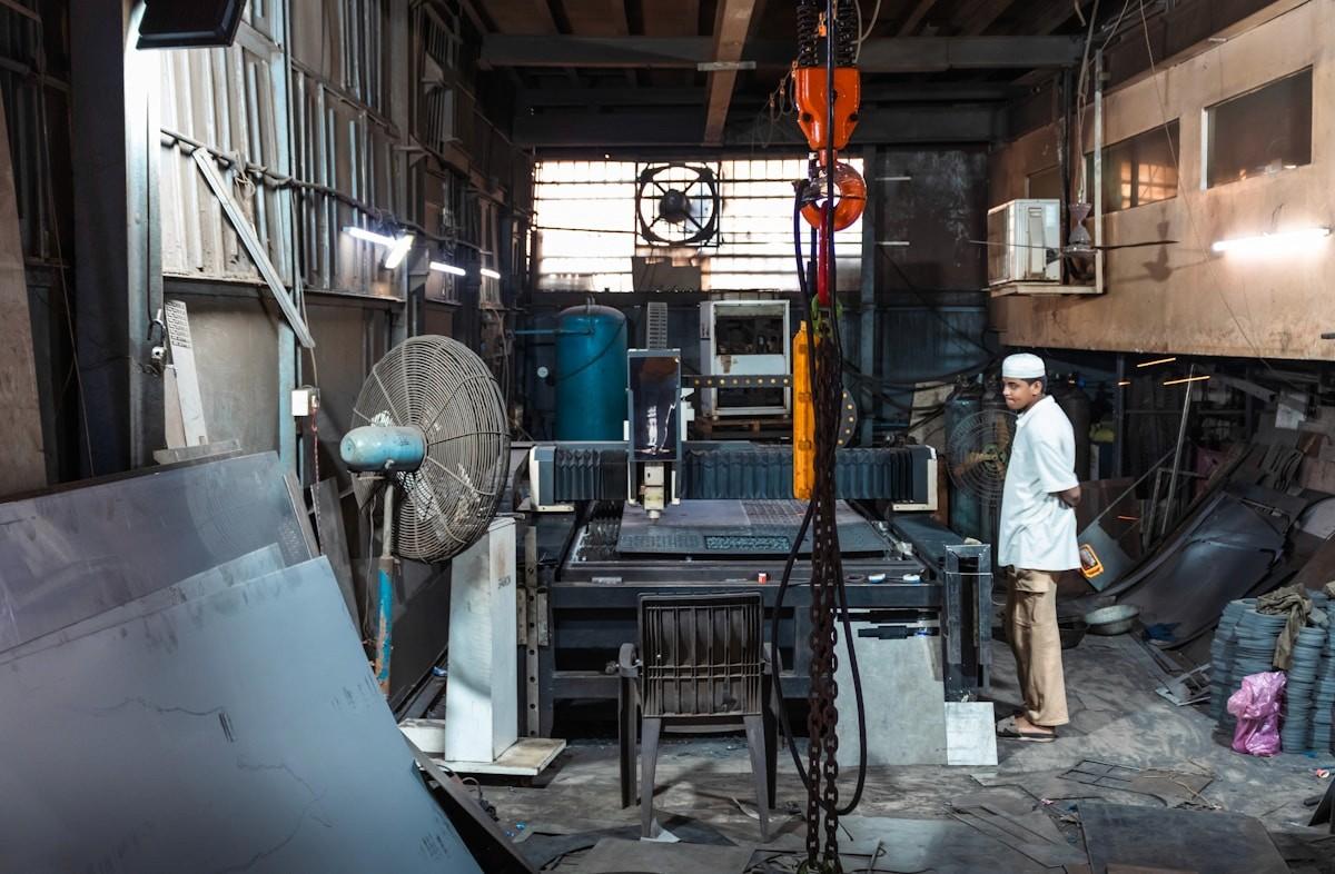 A worker in a fabrication shop